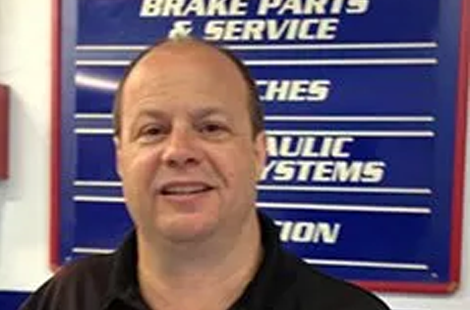 Person smiling at repair shop