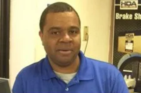 Person wearing blue collared shirt