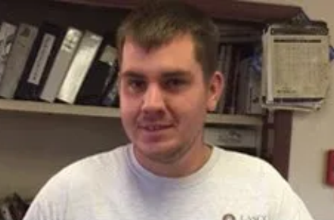 Person standing in office environment