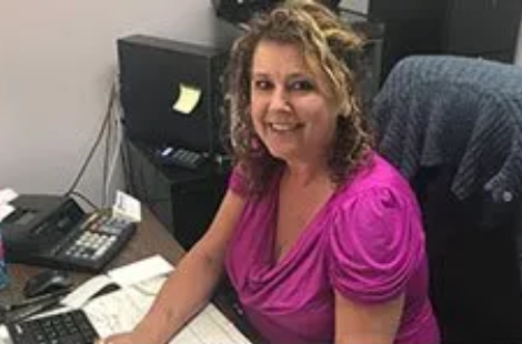 Office worker at desk smiling