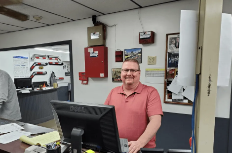 Man smiling at service counter